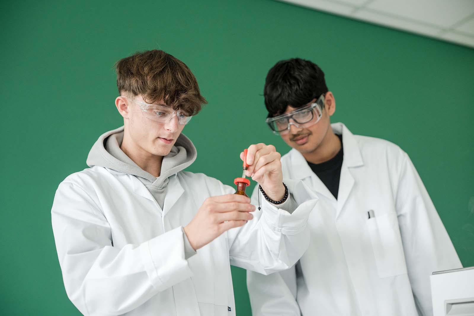 Science students performing experiment in Laboratory