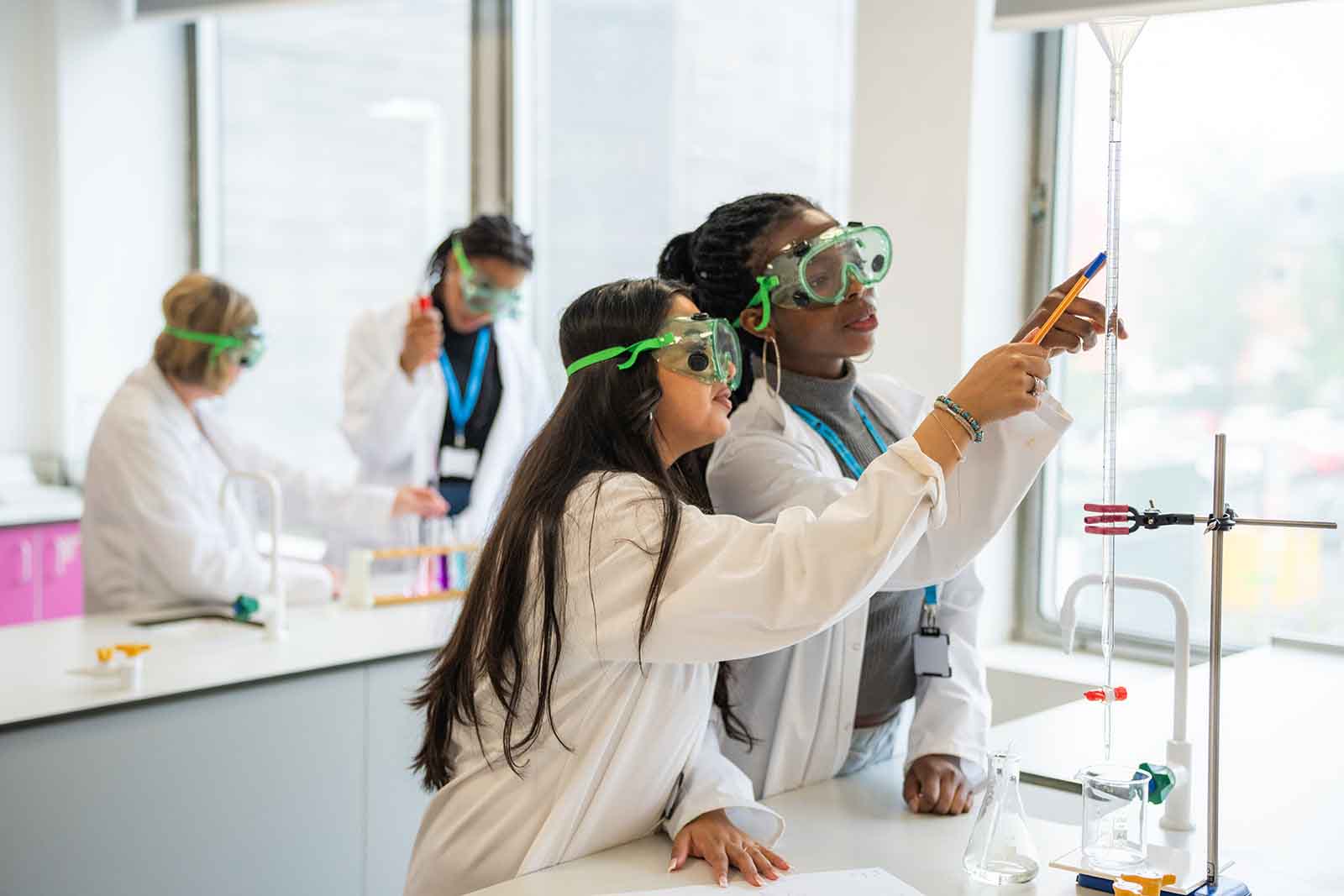 Science students performing experiment in Laboratory